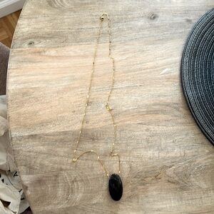 Fun long necklace with purple stone